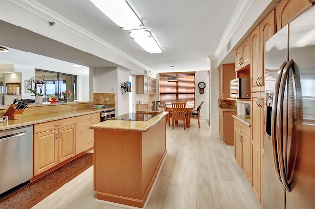 kitchen featuring appliances with stainless steel finishes, crown molding, light stone countertops, and light brown cabinets