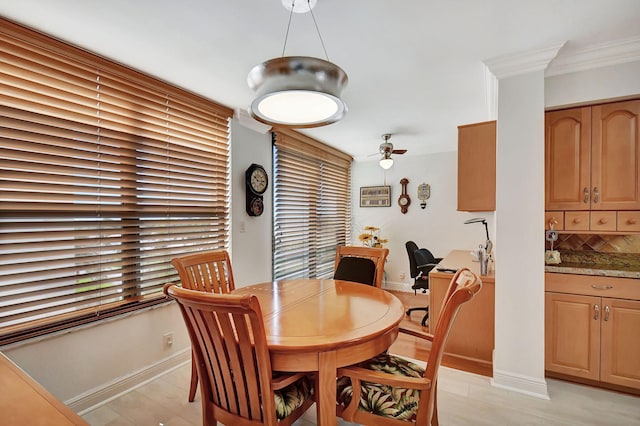 dining room featuring ceiling fan and ornamental molding