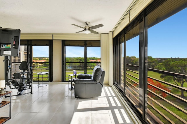 sunroom with ceiling fan and a wealth of natural light