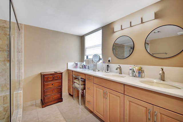 bathroom with tile patterned flooring, walk in shower, and vanity