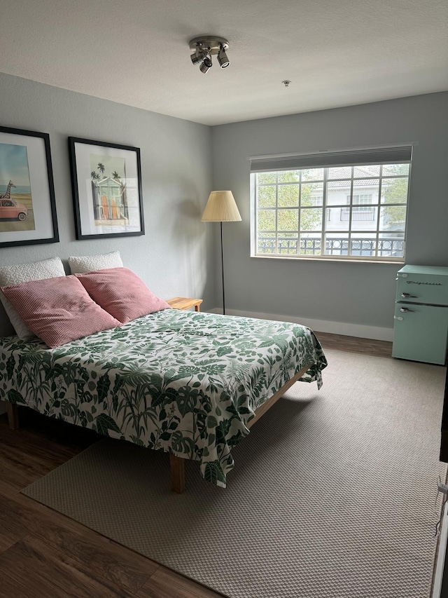 bedroom featuring hardwood / wood-style flooring