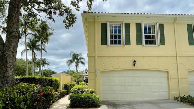 view of property exterior featuring a garage