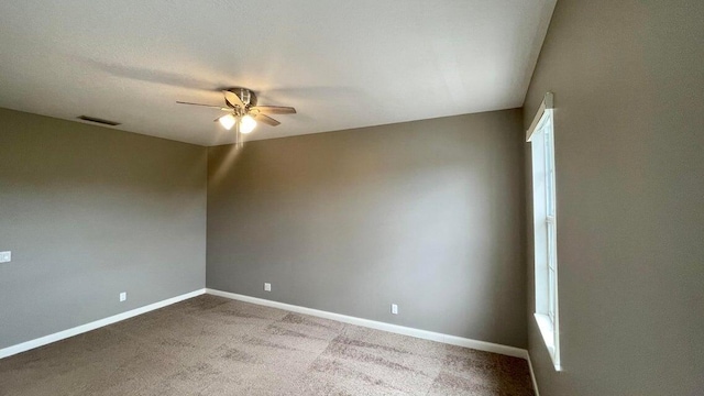 carpeted empty room with ceiling fan