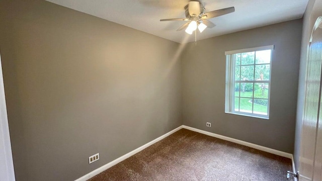 carpeted empty room with ceiling fan