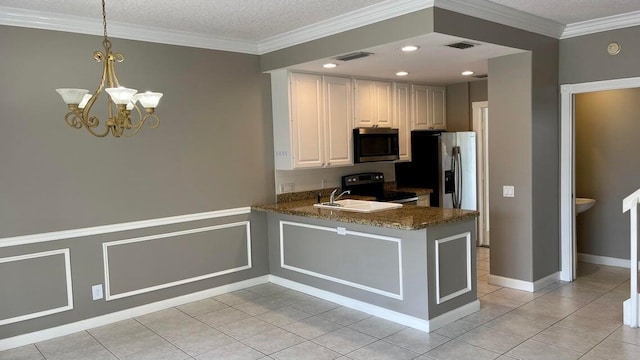 kitchen featuring kitchen peninsula, black electric range, decorative light fixtures, a notable chandelier, and white cabinets