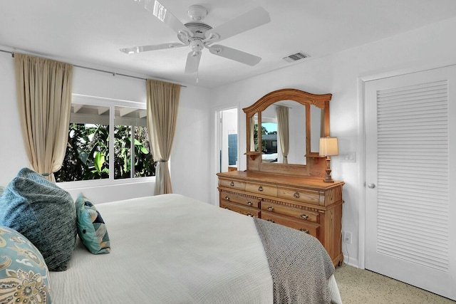 bedroom featuring ceiling fan and multiple windows