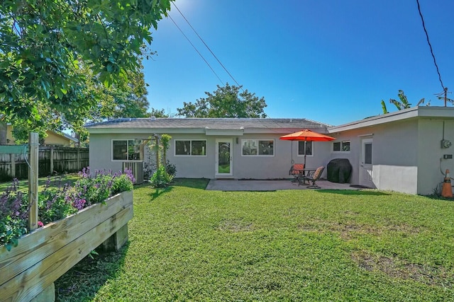 back of house featuring a patio, cooling unit, and a lawn