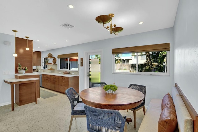 dining space featuring sink