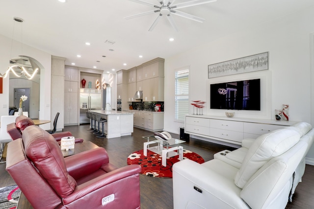 living room with sink, dark hardwood / wood-style floors, and ceiling fan