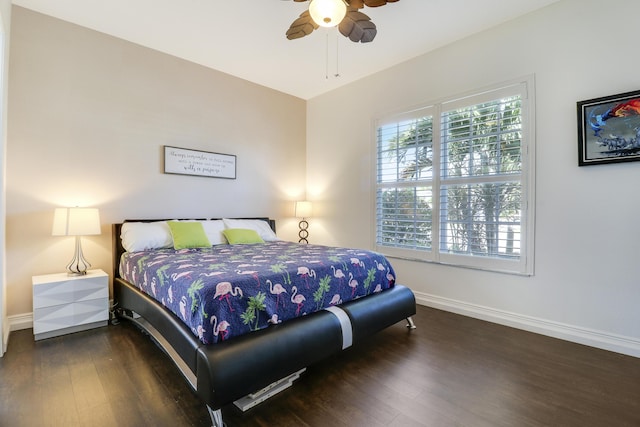 bedroom with ceiling fan and dark hardwood / wood-style flooring