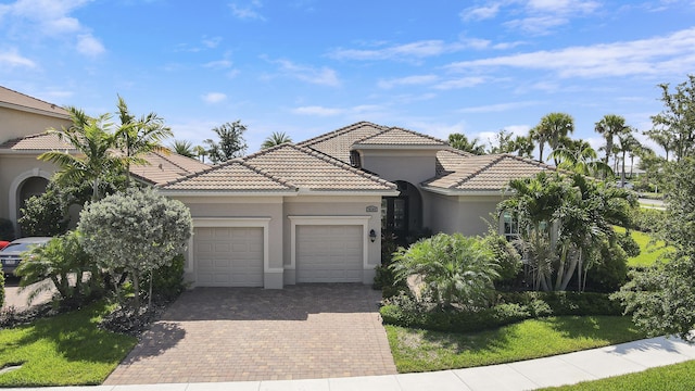 mediterranean / spanish-style home featuring a garage