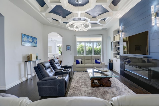 living room featuring dark hardwood / wood-style flooring, coffered ceiling, and a high ceiling