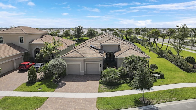 view of front facade featuring a garage and a front lawn