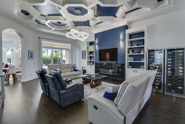 living room with dark hardwood / wood-style flooring, coffered ceiling, beverage cooler, and a chandelier