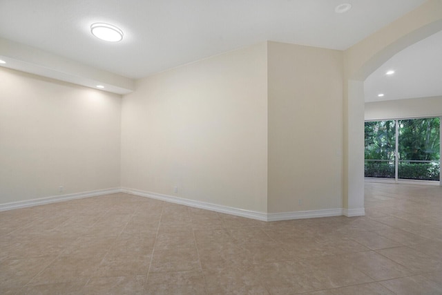 7575 Orchid Hammock Dr, West Palm Beach, FL 33412 - spare room with recessed lighting, arched walkways, tile patterned flooring, and baseboards