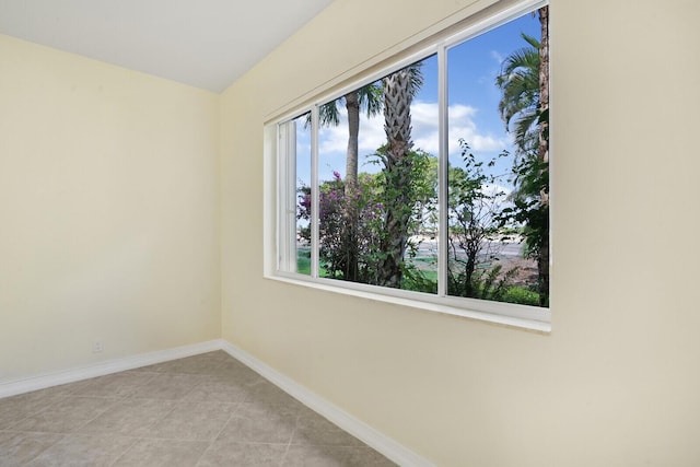 unfurnished room with light tile patterned floors