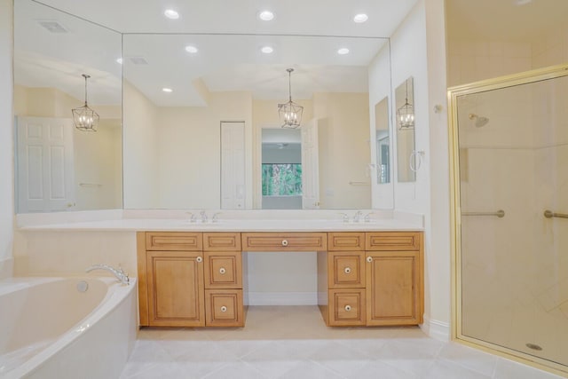 bathroom with tile patterned flooring, vanity, and plus walk in shower