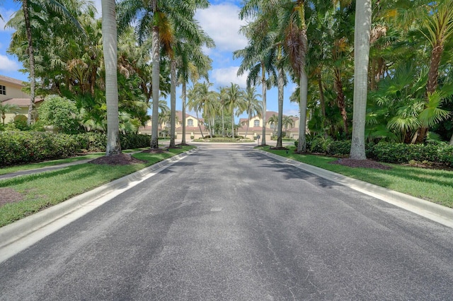 7575 Orchid Hammock Dr, West Palm Beach, FL 33412 - view of asphalt street featuring curbs, a residential view, and sidewalks