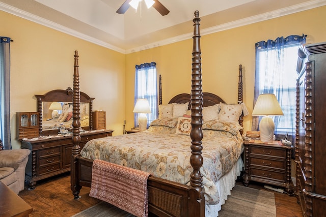 bedroom featuring ornamental molding, dark hardwood / wood-style floors, and ceiling fan