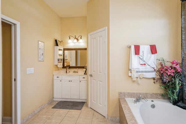 bathroom with tiled bath, oversized vanity, and tile floors