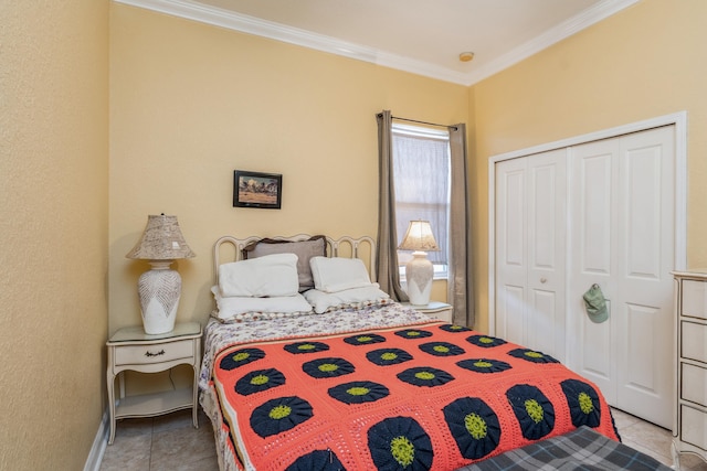 bedroom featuring tile floors, a closet, and crown molding