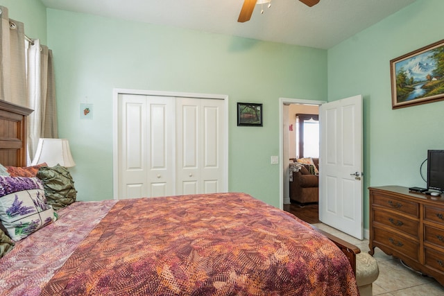 tiled bedroom featuring a closet and ceiling fan