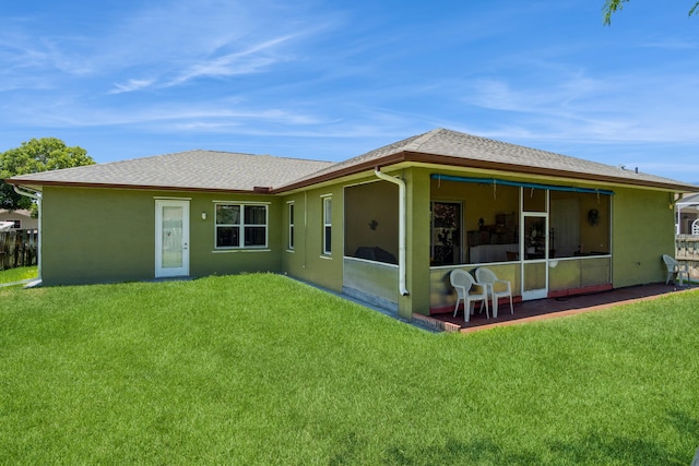 rear view of house with a lawn