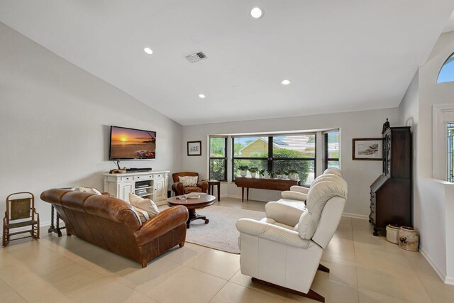 tiled living room with lofted ceiling