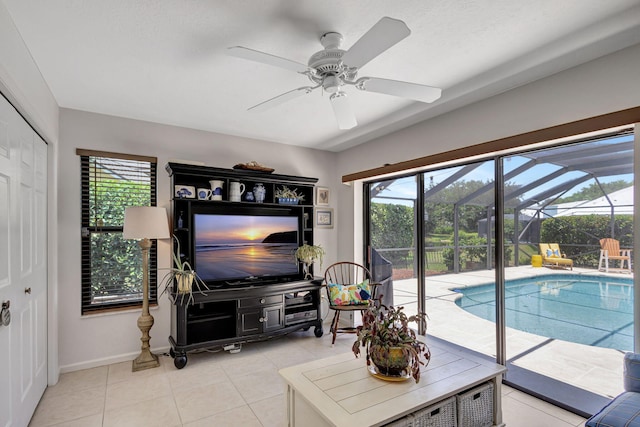 tiled living room with ceiling fan