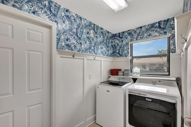 laundry area with independent washer and dryer