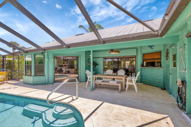 exterior space featuring ceiling fan, a patio area, and a lanai