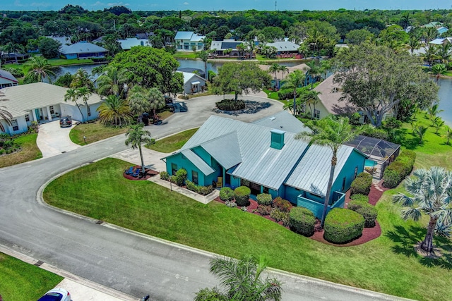 birds eye view of property featuring a water view