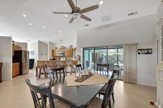 dining area featuring ceiling fan and light tile patterned flooring