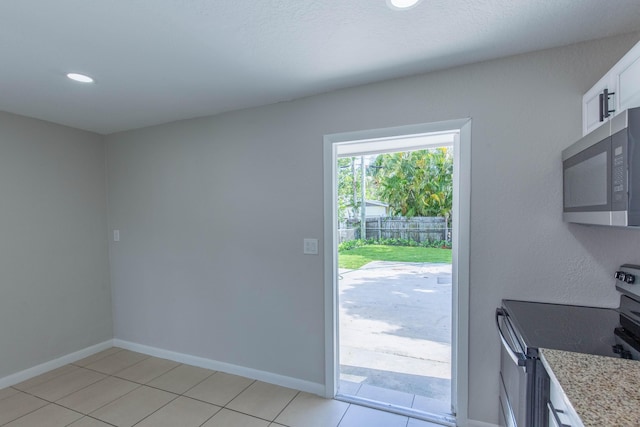 doorway featuring light tile patterned floors