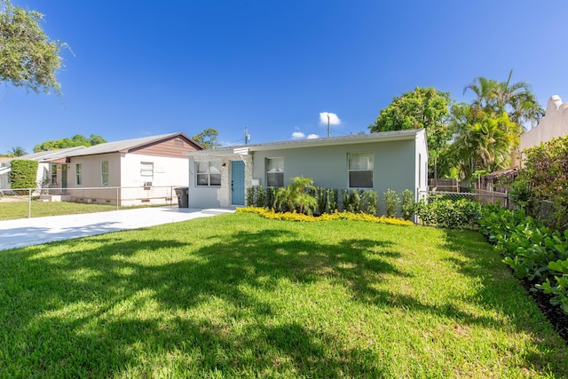 ranch-style house featuring a front lawn