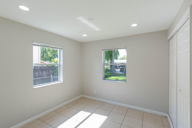 empty room with light tile patterned floors