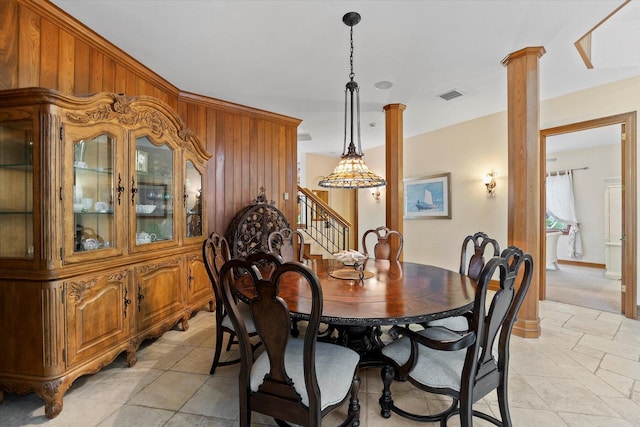 dining space featuring ornate columns