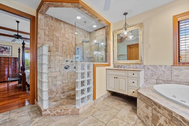 bathroom featuring vanity, ceiling fan, crown molding, wood-type flooring, and independent shower and bath