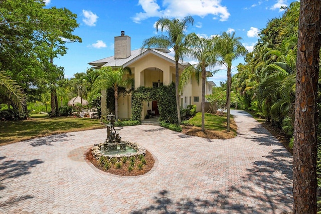 view of front of property with a front lawn