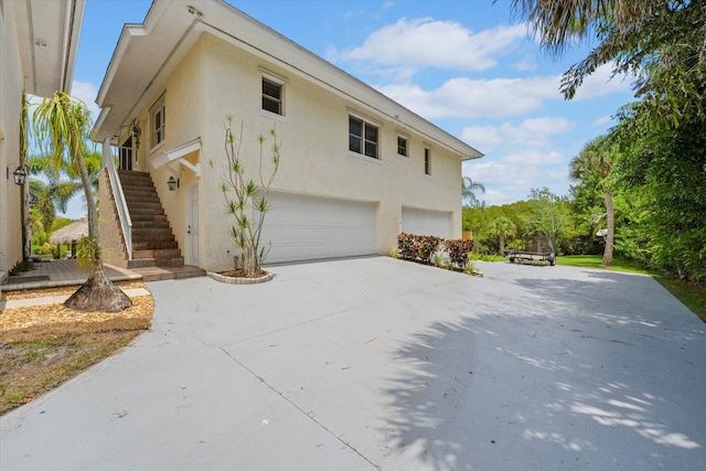 view of side of property featuring a garage