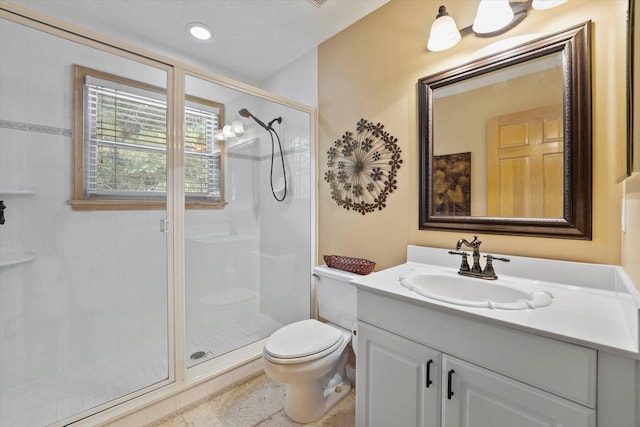 bathroom with an enclosed shower, vanity, and toilet