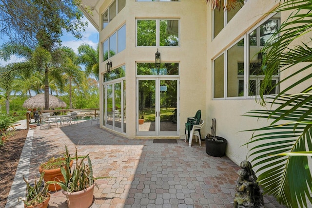 entrance to property with a patio area and french doors