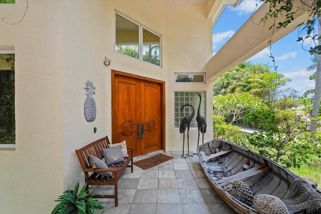 view of exterior entry featuring a porch