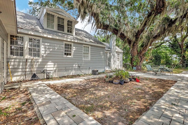 view of property exterior featuring a patio