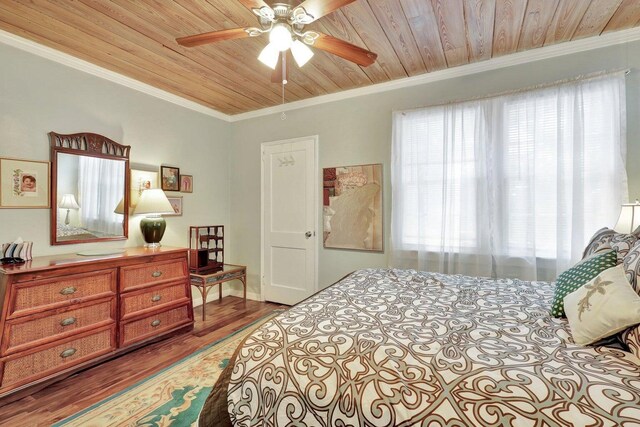 bedroom with light wood-type flooring, wooden ceiling, ceiling fan, and ornamental molding