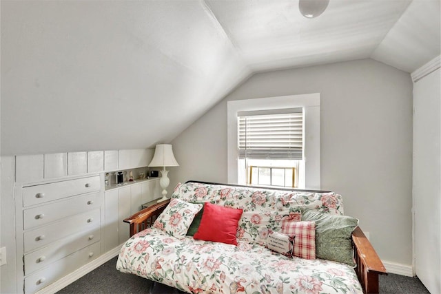 carpeted bedroom featuring vaulted ceiling