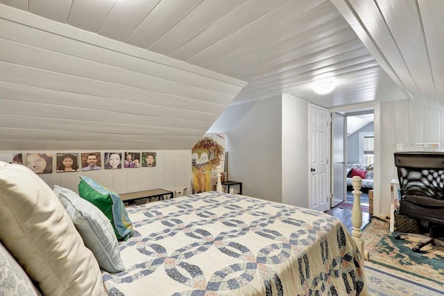 bedroom with hardwood / wood-style floors, vaulted ceiling, and wood ceiling