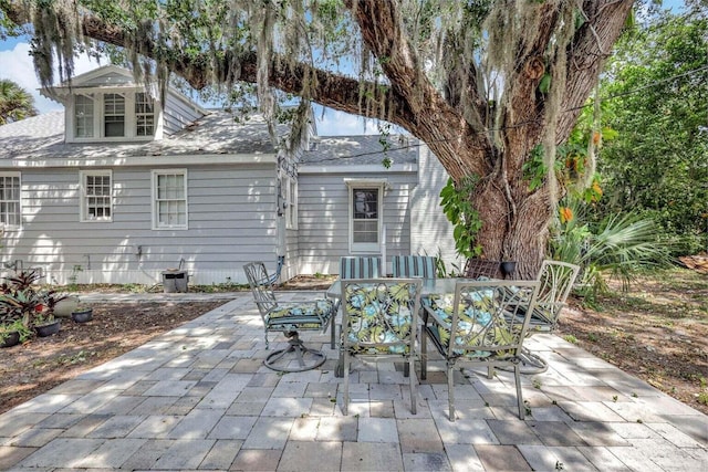 back of property featuring a patio