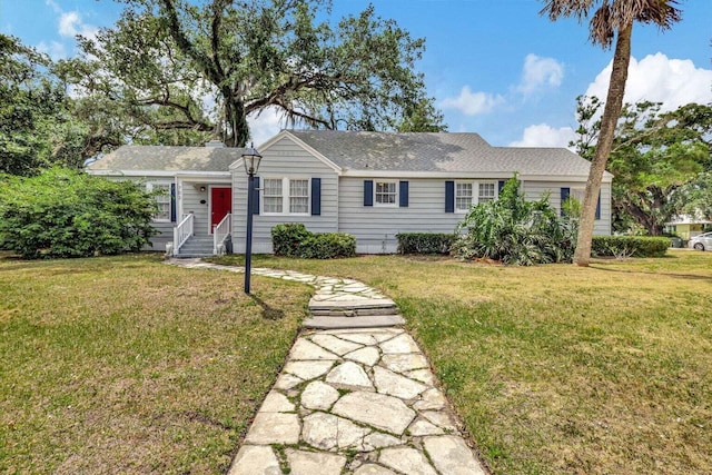 ranch-style house with a front lawn