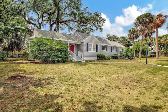 single story home featuring a front lawn